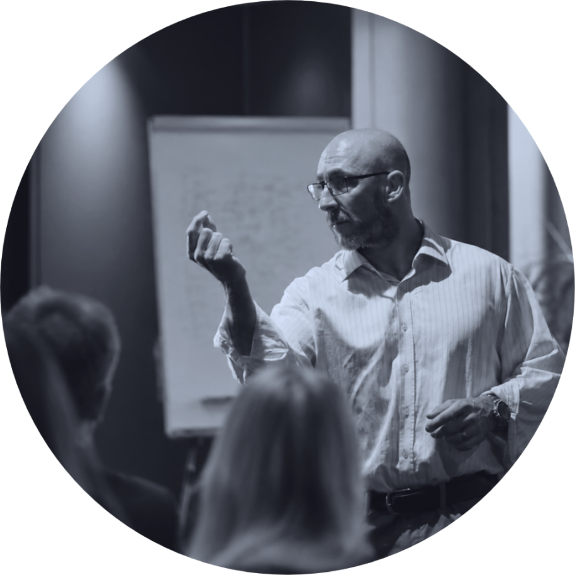 Dan Beverly working with a team at a flip chart