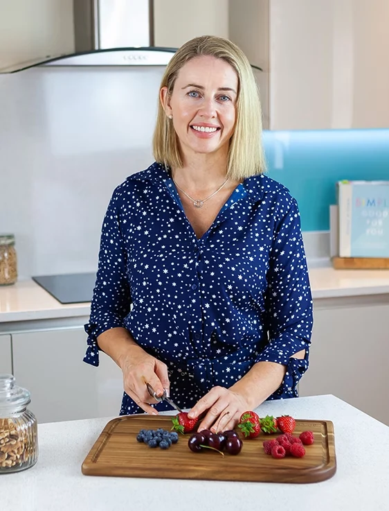 Caroline Farrell, Registered Nutritionist preparing fresh berries in the kitchen